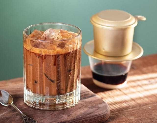 Vietnamese iced coffee, Vietnamese coffee recipe, how to make Vietnamese iced coffee, Vietnamese iced milk coffee, cà phê sữa đá, Vietnamese coffee beans, phin filter coffee, sweetened condensed milk coffee, traditional Vietnamese coffee, Vietnamese coffee brewing method