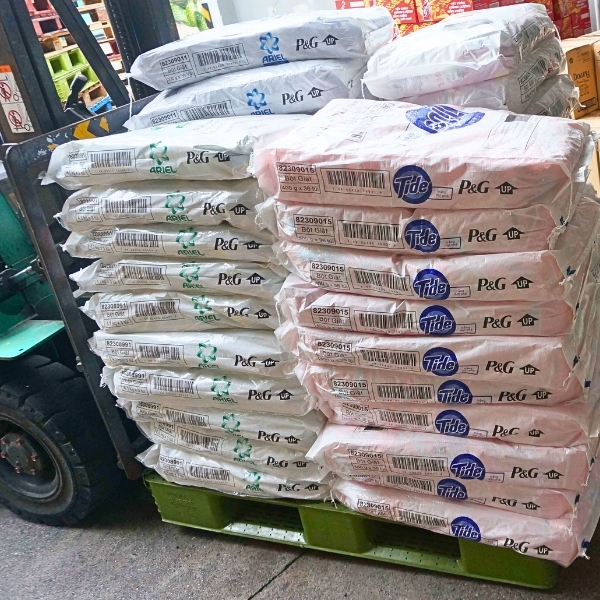 Tide Original powder detergent stacked and ready for shipping, loaded onto a forklift for export