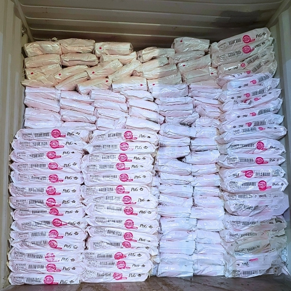 Tide Plus Downy powder detergent packed in a container for global export.