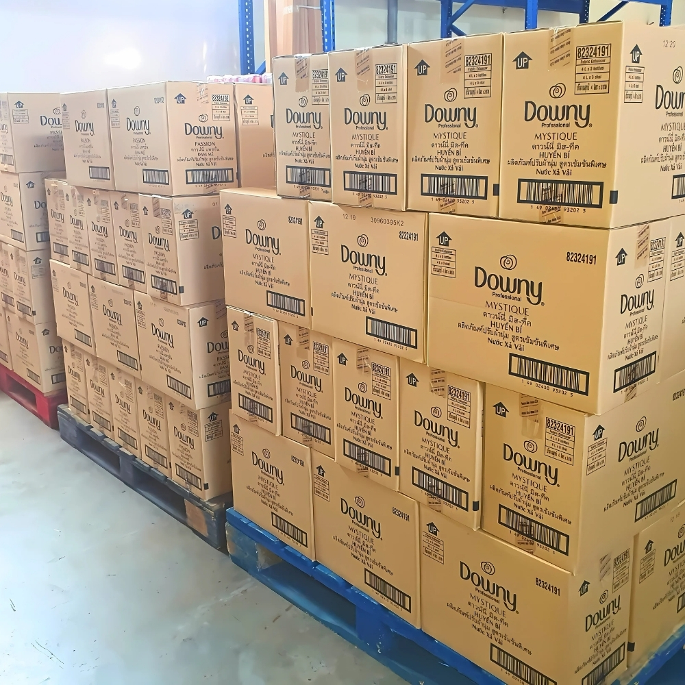 Stacks of Downy Mystique wholesale boxes in a warehouse for export