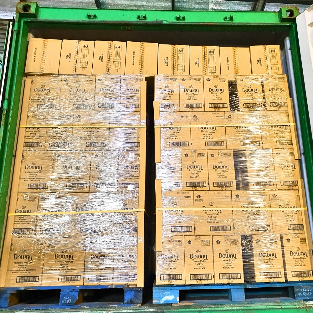Container loaded with pallets of Downy Sunrise Fresh boxes for wholesale shipment by Asia Grocery
