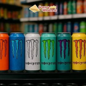 Diverse Monster Energy drink cans in multiple sizes and colors on a store shelf.