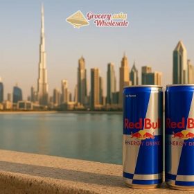 Red Bull cans in front of a modern Middle Eastern skyline, symbolizing market integration and growth.