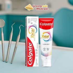 Image of Colgate Total Toothpaste with dental tools.