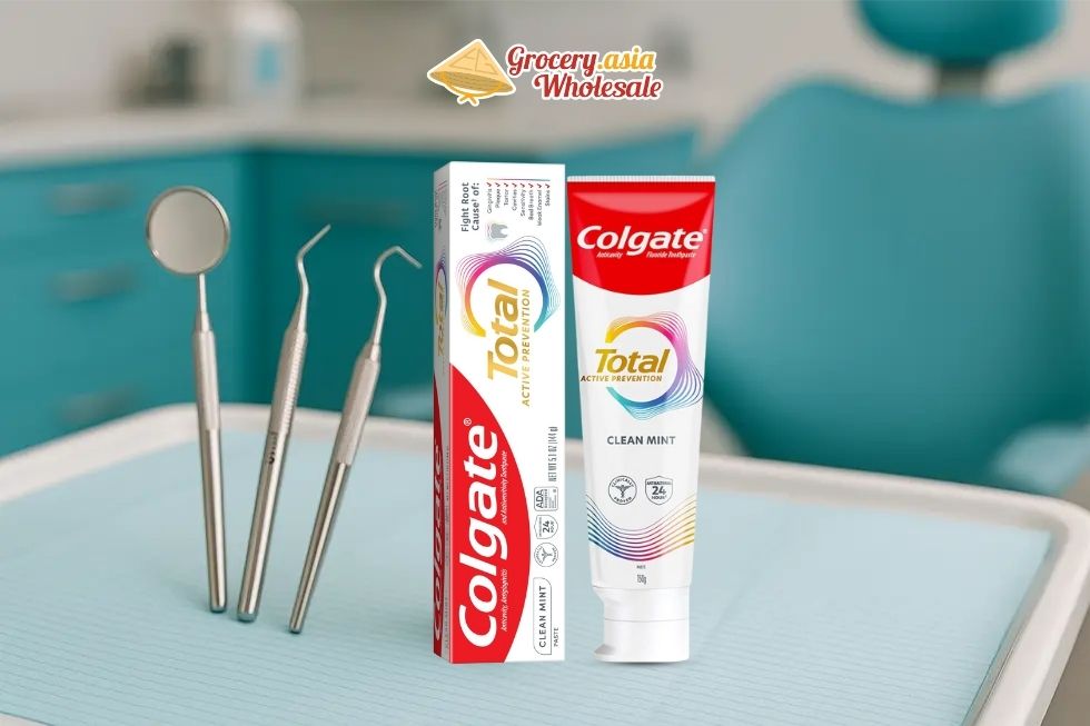Image of Colgate Total Toothpaste with dental tools.