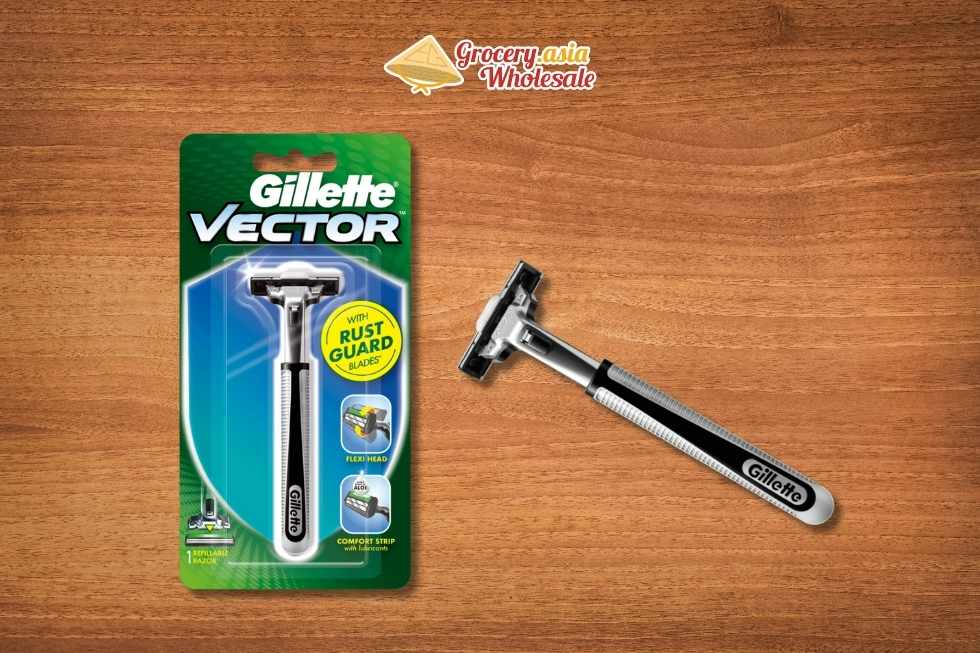 A vintage Gillette Trac II razor beside a contemporary multi-blade razor.