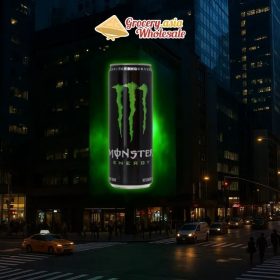 Billboard advertisement of Monster Energy in a bustling city environment.